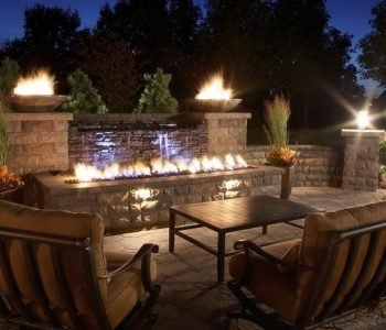 A backyard with a stunning fountain a